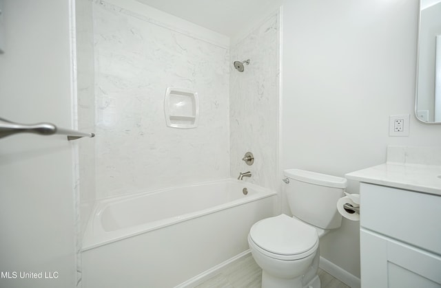 bathroom with toilet, shower / bathing tub combination, and vanity