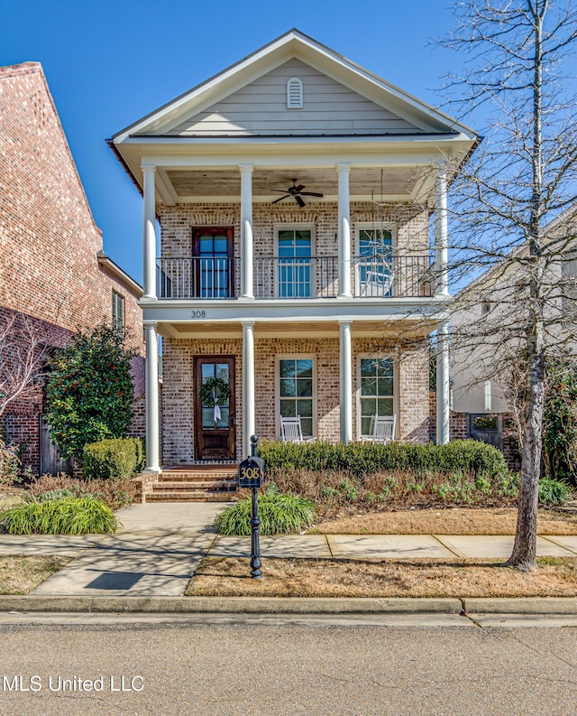 neoclassical / greek revival house with a balcony, ceiling fan, and a porch