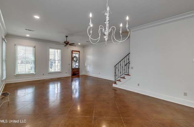 interior space with ceiling fan with notable chandelier, dark tile patterned floors, and crown molding