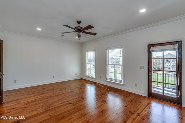 unfurnished room with ceiling fan, dark wood-type flooring, and crown molding