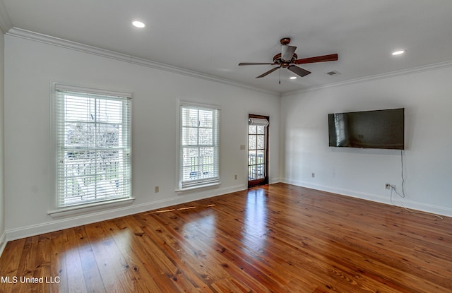 unfurnished living room with ceiling fan, ornamental molding, and dark hardwood / wood-style floors