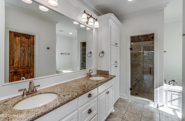 bathroom with vanity, ornamental molding, and a shower with door