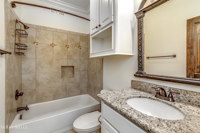 full bathroom featuring toilet, tiled shower / bath, vanity, and ornamental molding