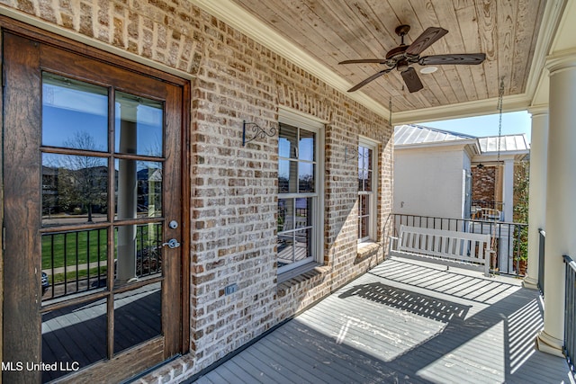 deck with ceiling fan and a porch