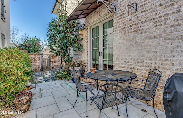 view of patio / terrace featuring french doors and a grill