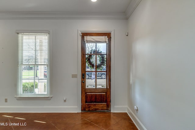 tiled foyer entrance featuring ornamental molding