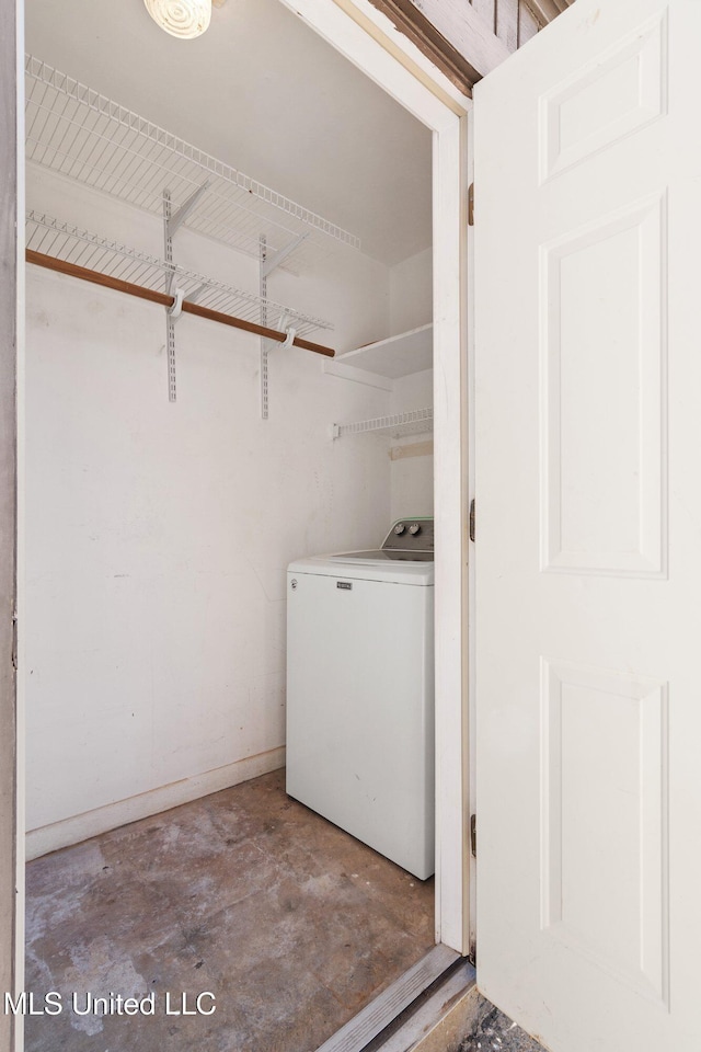 laundry room featuring washer / clothes dryer and laundry area