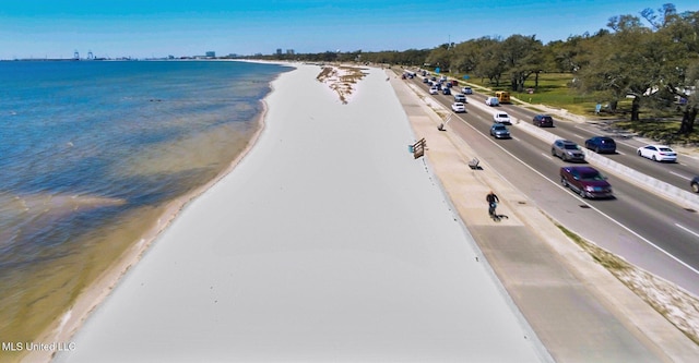 drone / aerial view with a view of the beach and a water view
