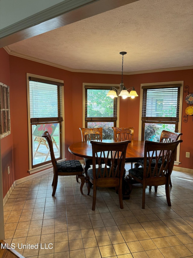 dining space featuring crown molding, light tile patterned floors, and plenty of natural light