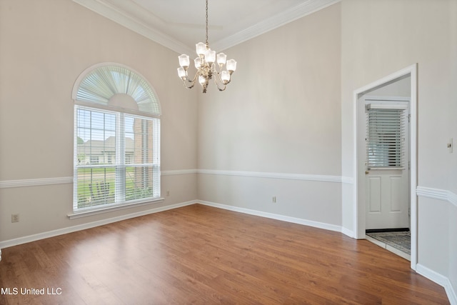 6375 Darren Dr, Olive Branch, MS 38654 - unfurnished room with a chandelier, wood finished floors, ornamental molding, and baseboards
