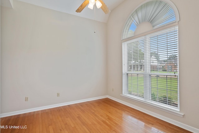 6375 Darren Dr, Olive Branch, MS 38654 - empty room with wood finished floors, baseboards, lofted ceiling, and a ceiling fan