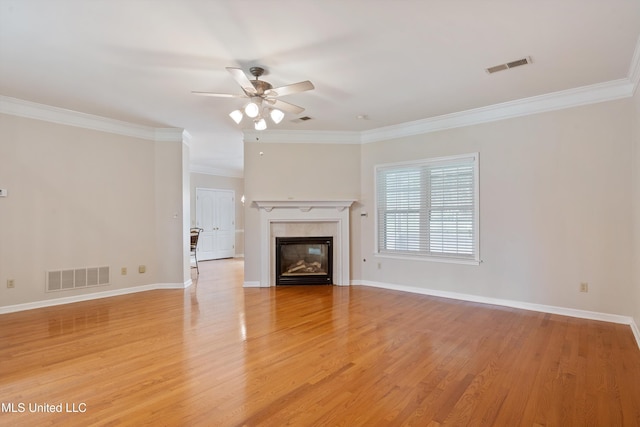 6375 Darren Dr, Olive Branch, MS 38654 - unfurnished living room featuring a ceiling fan, light wood finished floors, a fireplace, ornamental molding, and baseboards