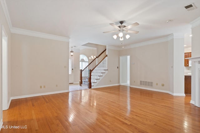 6375 Darren Dr, Olive Branch, MS 38654 - unfurnished living room featuring stairway, ceiling fan, light wood-style floors, baseboards, and crown molding