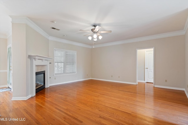 6375 Darren Dr, Olive Branch, MS 38654 - unfurnished living room featuring a ceiling fan, ornamental molding, a premium fireplace, light wood-style flooring, and baseboards