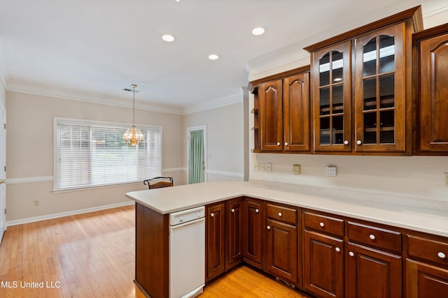 6375 Darren Dr, Olive Branch, MS 38654 - kitchen with light countertops, glass insert cabinets, a peninsula, decorative light fixtures, and ornamental molding