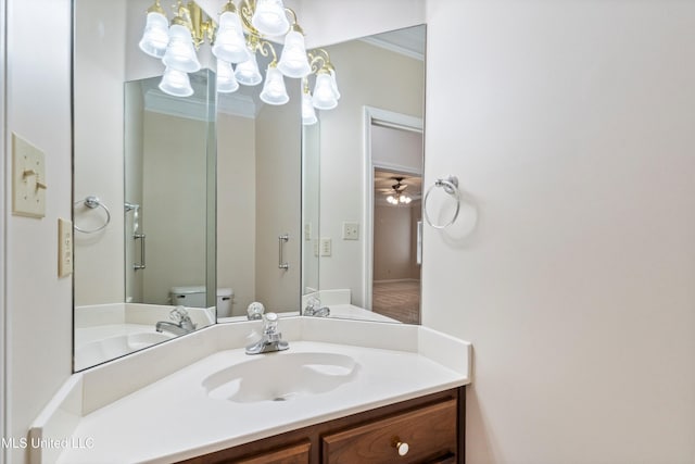 6375 Darren Dr, Olive Branch, MS 38654 - bathroom with a chandelier, toilet, vanity, ornamental molding, and ceiling fan