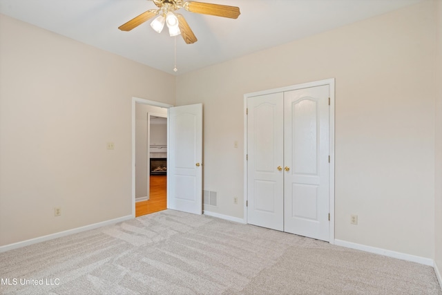6375 Darren Dr, Olive Branch, MS 38654 - unfurnished bedroom featuring carpet flooring, a closet, baseboards, and ceiling fan