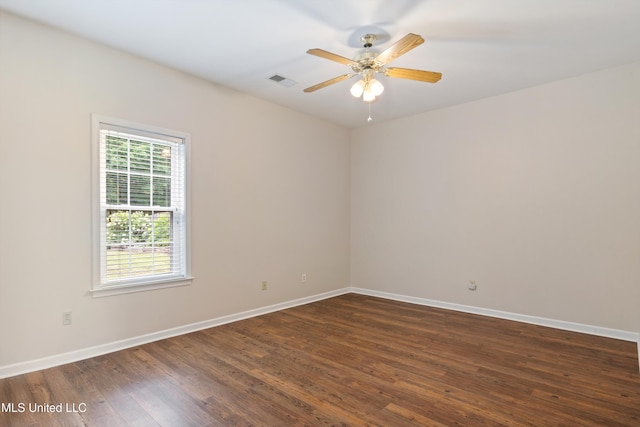6375 Darren Dr, Olive Branch, MS 38654 - spare room with ceiling fan, dark wood finished floors, and baseboards