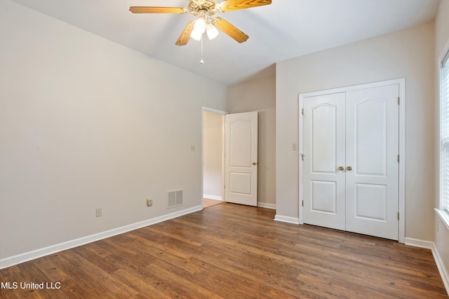 6375 Darren Dr, Olive Branch, MS 38654 - unfurnished bedroom featuring wood finished floors, baseboards, a closet, and ceiling fan