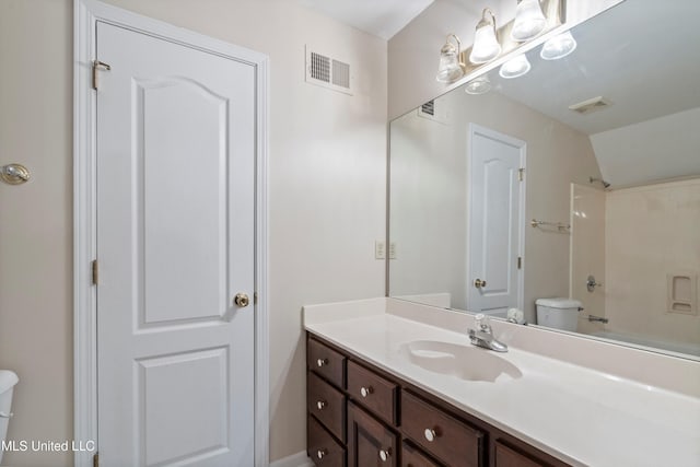 6375 Darren Dr, Olive Branch, MS 38654 - bathroom featuring toilet, vanity, washtub / shower combination, and vaulted ceiling