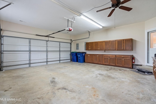6375 Darren Dr, Olive Branch, MS 38654 - garage with a garage door opener and ceiling fan