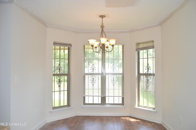136 Dakota St, Byram, MS 39272 - unfurnished dining area featuring a chandelier, ornamental molding, plenty of natural light, and dark wood-style floors