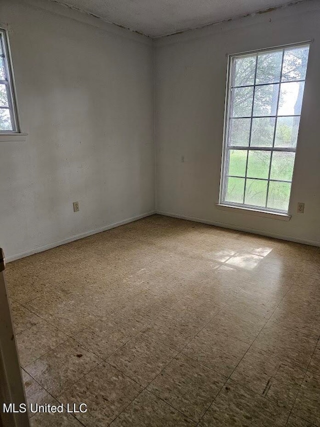 spare room with plenty of natural light