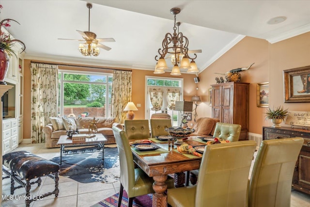dining area featuring lofted ceiling, ornamental molding, light tile patterned floors, and ceiling fan with notable chandelier