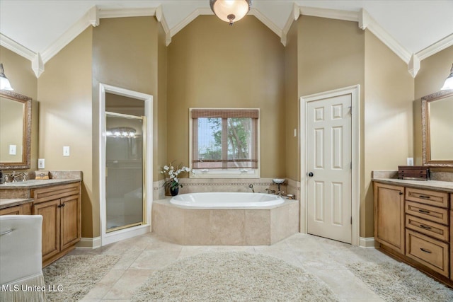 full bathroom with crown molding, a shower stall, a bath, and vanity