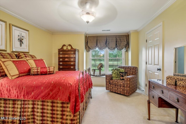 carpeted bedroom with visible vents, ornamental molding, and ceiling fan