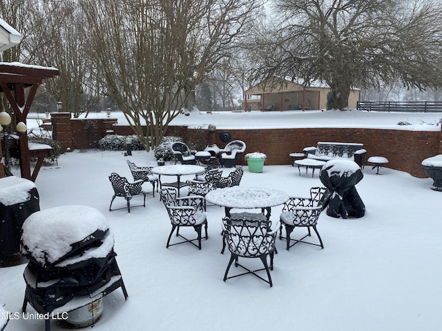 7300 Davidson Rd, Olive Branch, MS 38654 - snow covered patio featuring a patio and outdoor dining space