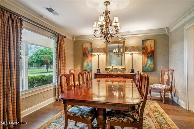 dining room with plenty of natural light, a notable chandelier, dark wood-type flooring, and visible vents