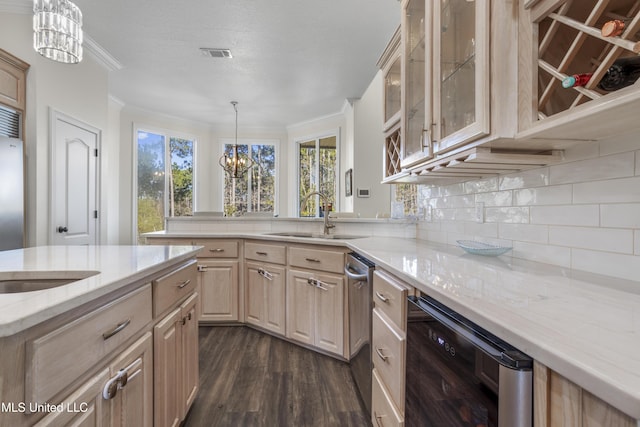 kitchen featuring sink, beverage cooler, a notable chandelier, pendant lighting, and light brown cabinetry