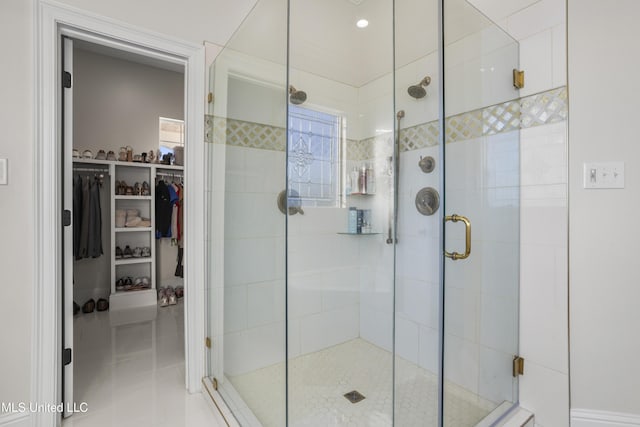 bathroom with tile patterned flooring and an enclosed shower