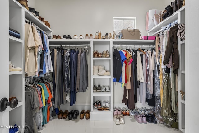 spacious closet featuring tile patterned floors