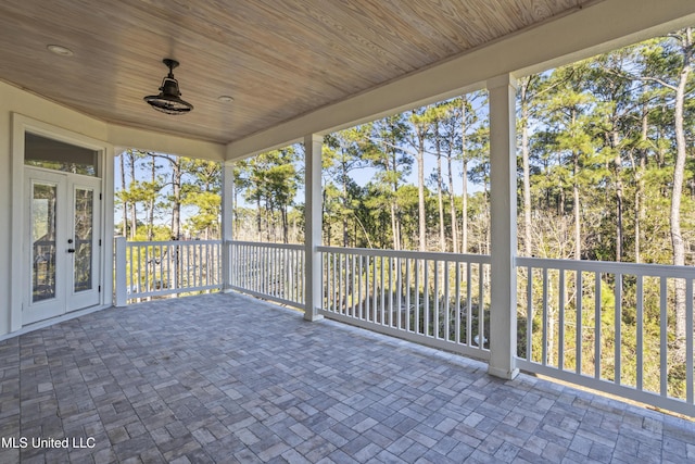 unfurnished sunroom featuring wooden ceiling