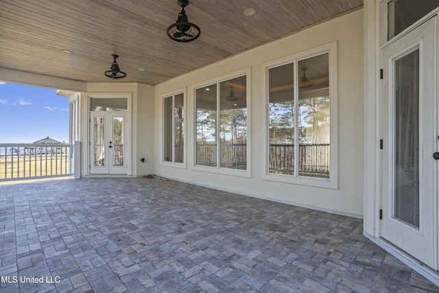 view of patio featuring ceiling fan