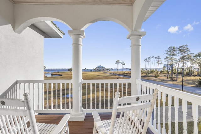 wooden deck with a water view