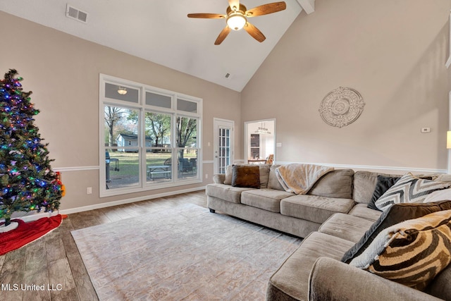 living room featuring hardwood / wood-style floors, ceiling fan, beam ceiling, and high vaulted ceiling