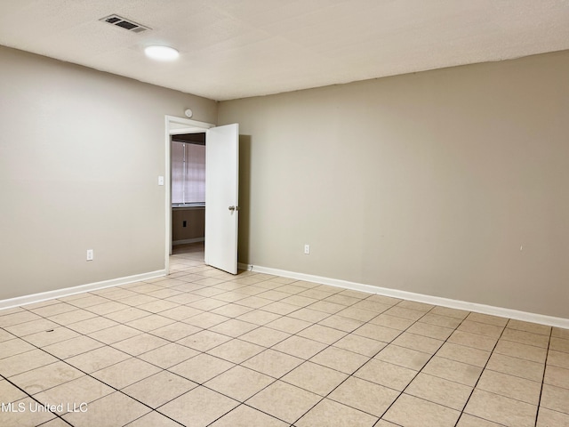 view of tiled spare room