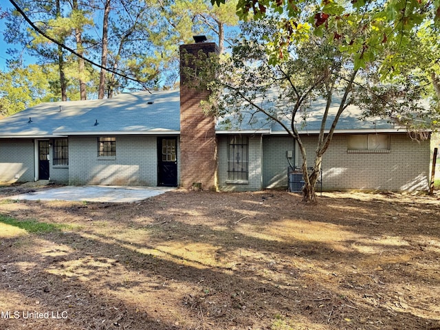 back of property with a patio area