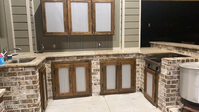 view of patio / terrace featuring area for grilling and sink