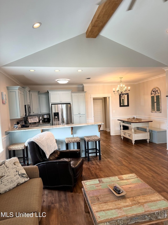 living room with ornamental molding, dark wood-type flooring, lofted ceiling with beams, and an inviting chandelier