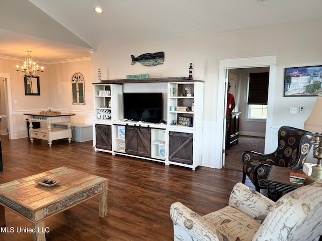 living room with ornamental molding, dark hardwood / wood-style flooring, an inviting chandelier, and lofted ceiling