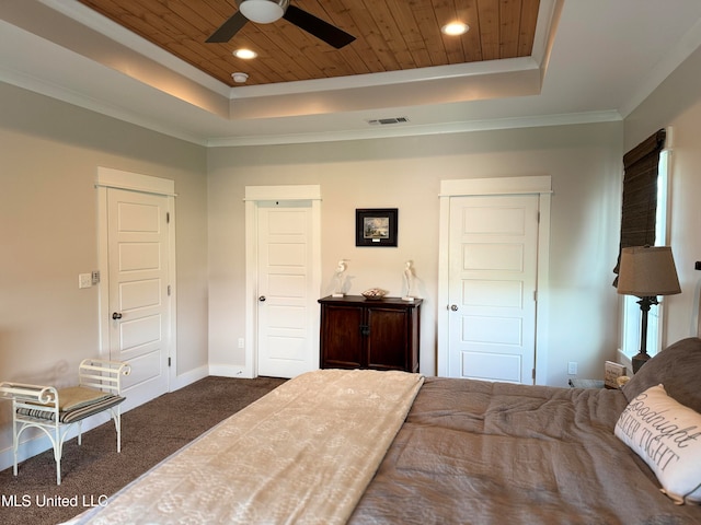 bedroom featuring wooden ceiling, dark colored carpet, crown molding, ceiling fan, and a tray ceiling