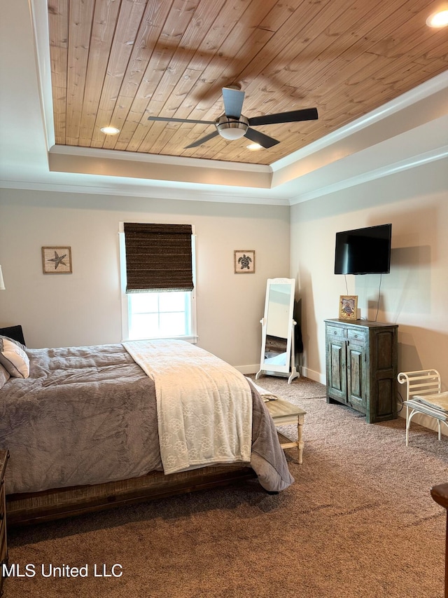 carpeted bedroom featuring a tray ceiling, ceiling fan, crown molding, and wood ceiling