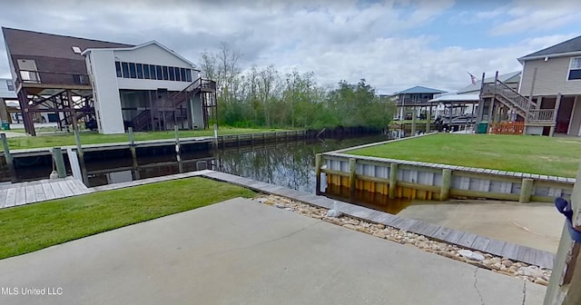 exterior space with a lawn and a water view