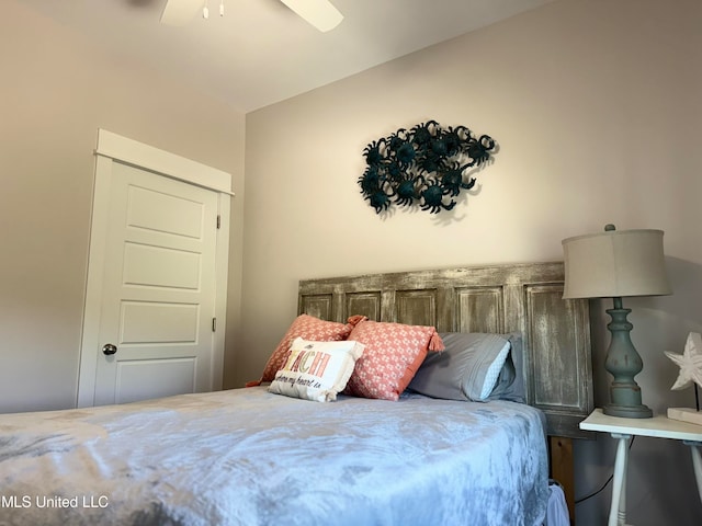 bedroom with ceiling fan and vaulted ceiling