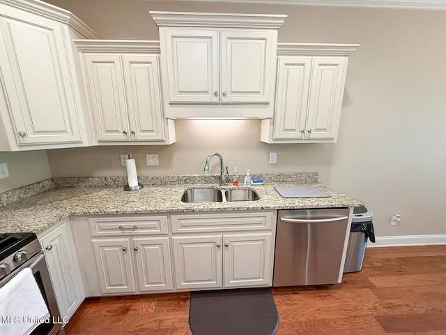 3041 Brambleberry Cv, Southaven, MS 38672 - kitchen featuring stainless steel appliances, light wood-style floors, white cabinets, and light stone countertops