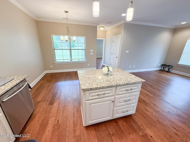 3041 Brambleberry Cv, Southaven, MS 38672 - kitchen with dishwasher, wood finished floors, crown molding, a chandelier, and white cabinetry